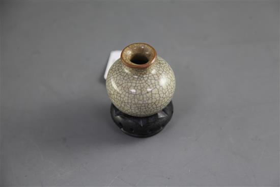 A small Chinese crackle-glaze globular vase, 18th/19th century, height 5.8cm, wood stand